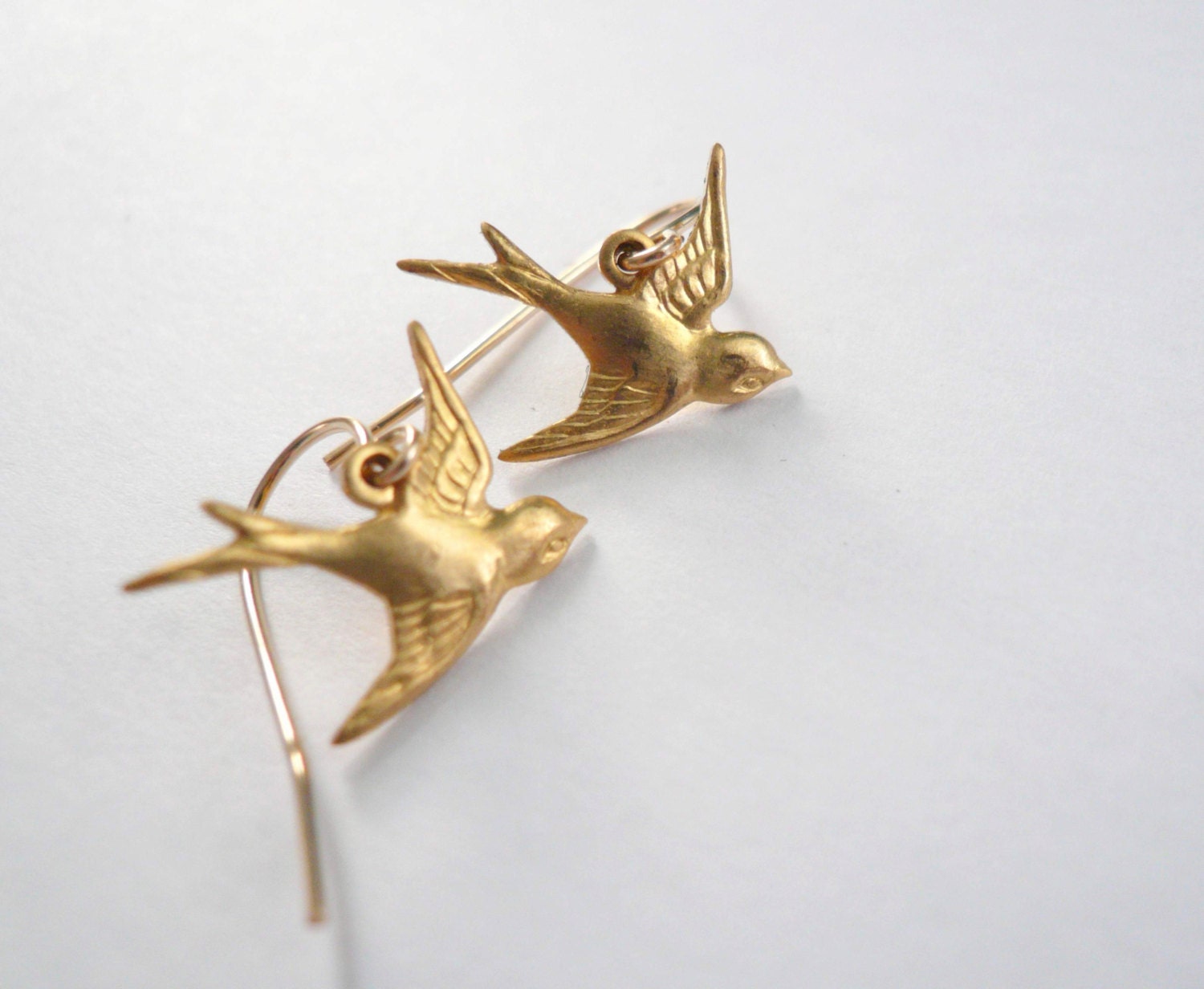 Little gold bird earrings. Brass gold birds on 14K gold fill ear wires. Dainty jewelry.