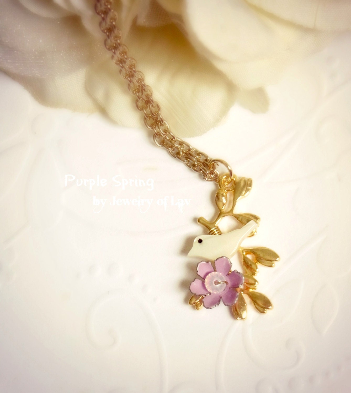 Purple Spring necklace made with mother of pearl bird, vintage flower charm, swarovski crystal etc
