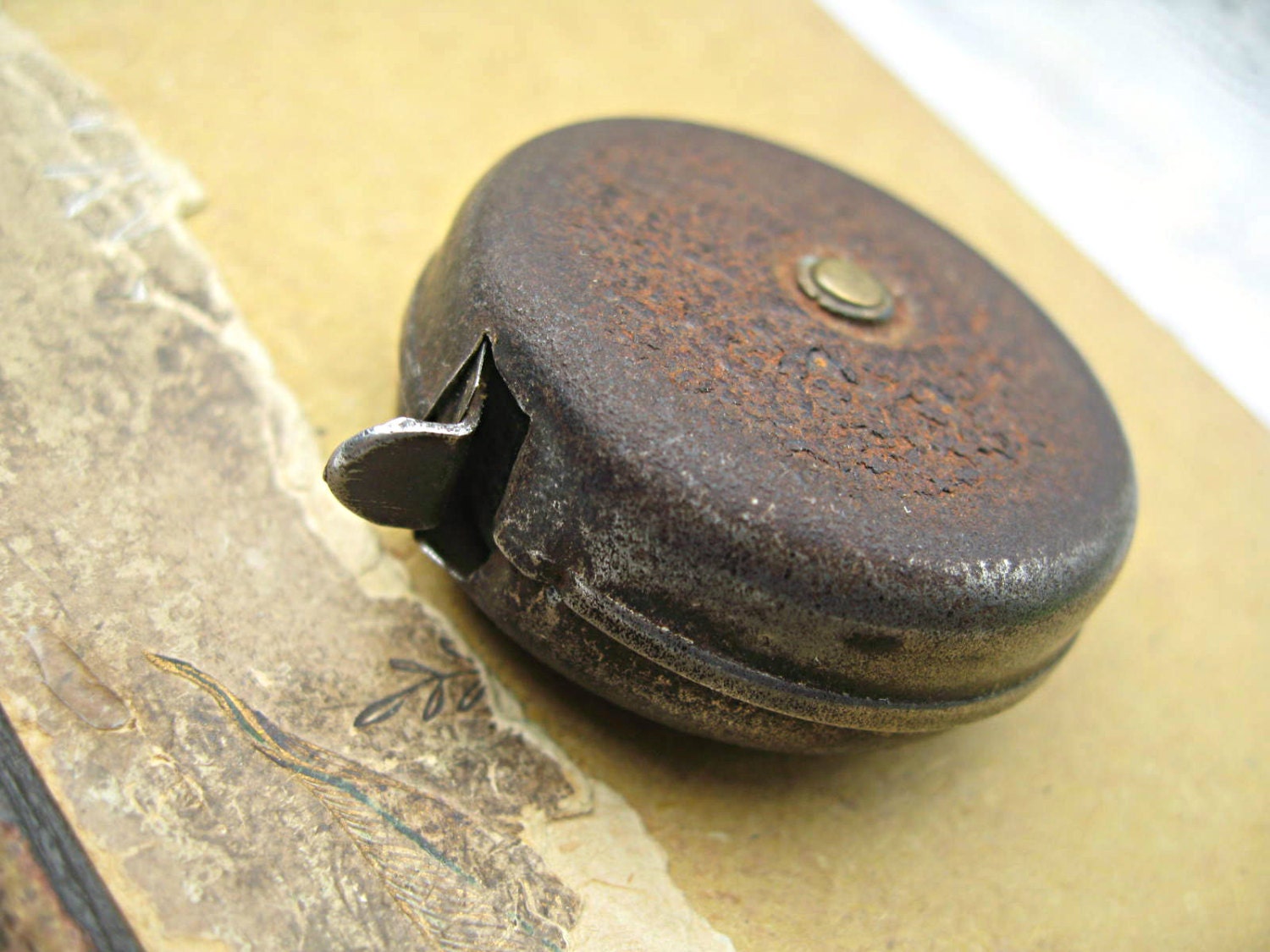 Tiny metal measuring tape, made in Europe, cute as can be