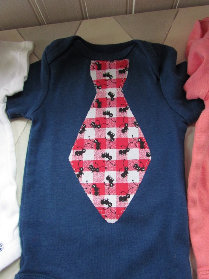Salmon colored bodysuit (Onesie) with sneakers tie for your little gentleman size 9-12 mos.