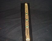 Vintage jewelry gold tone faux emerald bracelet