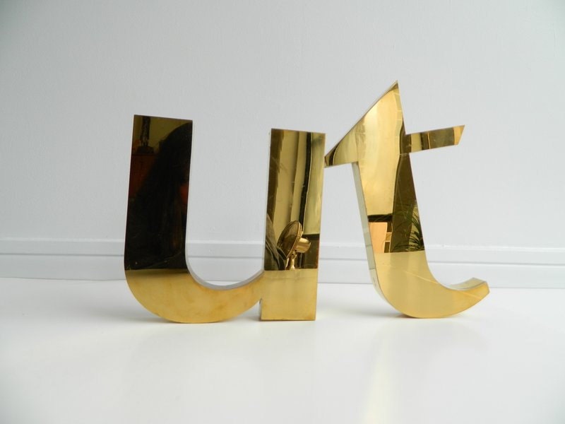 big brass plated letter t sign
