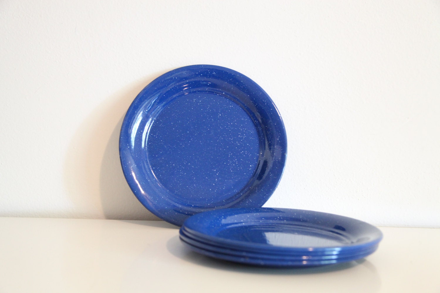 vintage set of five blue tin plates