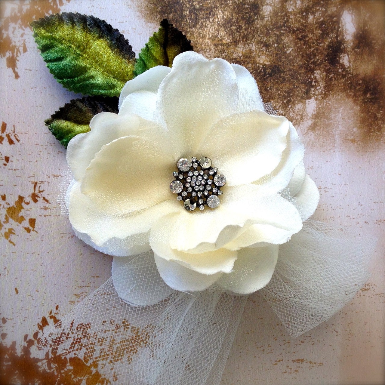 Soft ivory and pale golden/silver/ivory tulle magnolia hair clip. Crystal rhinestone center with alligator clip. Custom tulle colors.