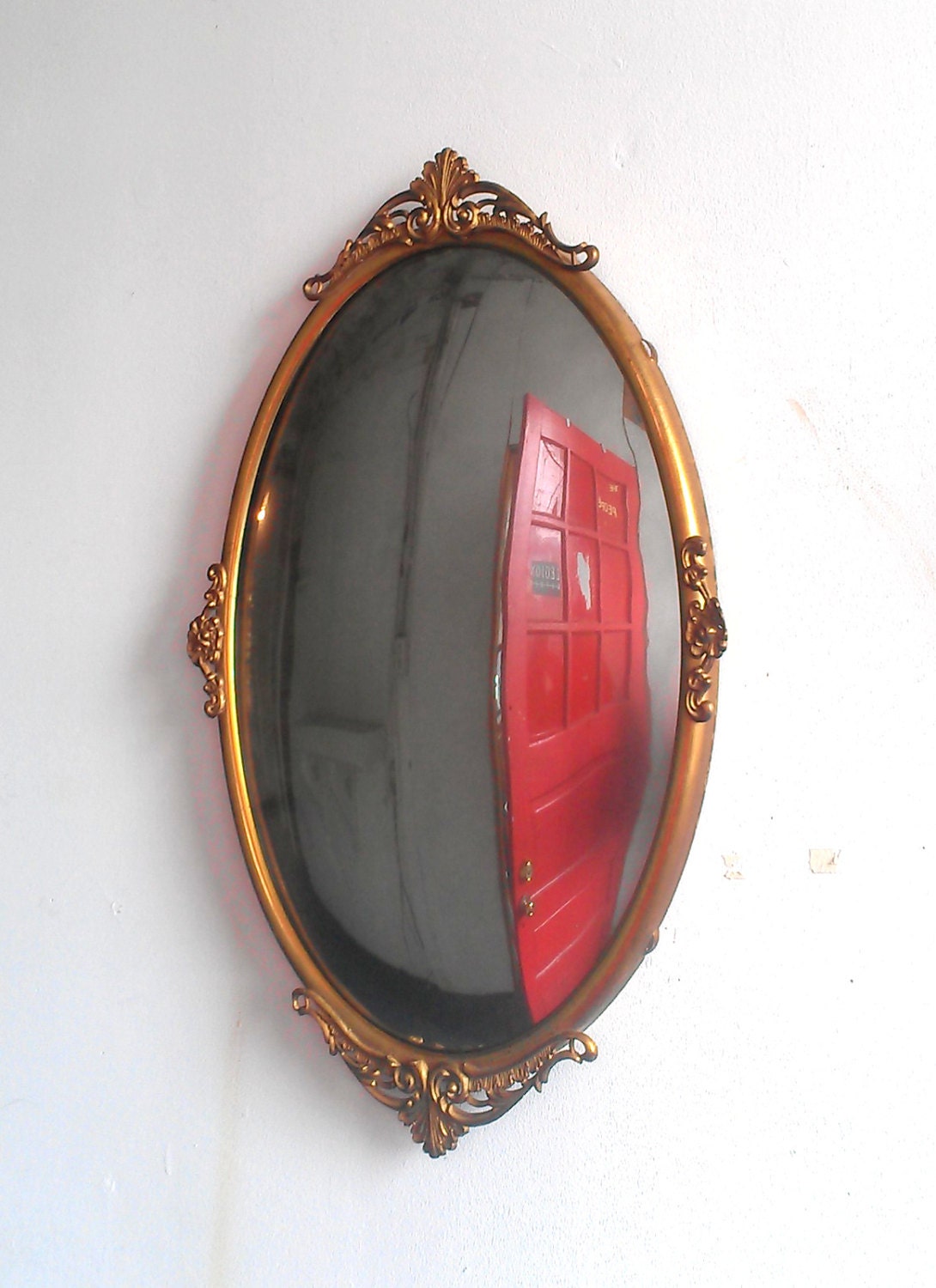Convex Wall Mirror in Antique Oval Brass Frame - 23 by 15 Inches