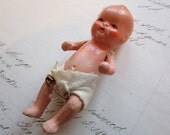 antique jointed miniature baby - marked JAPAN