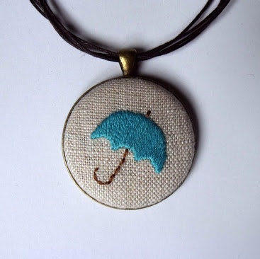 Hand embroidered umbrella cameo pendant necklace with antique bronze rounded back