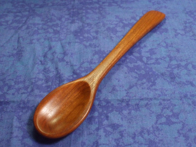 Hand carved eating spoon in rich cherry wood
