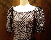 Clearance 40% Off A vintage 1970s disco cocktail party knit silver metallic sequined peplum top shirt size M L