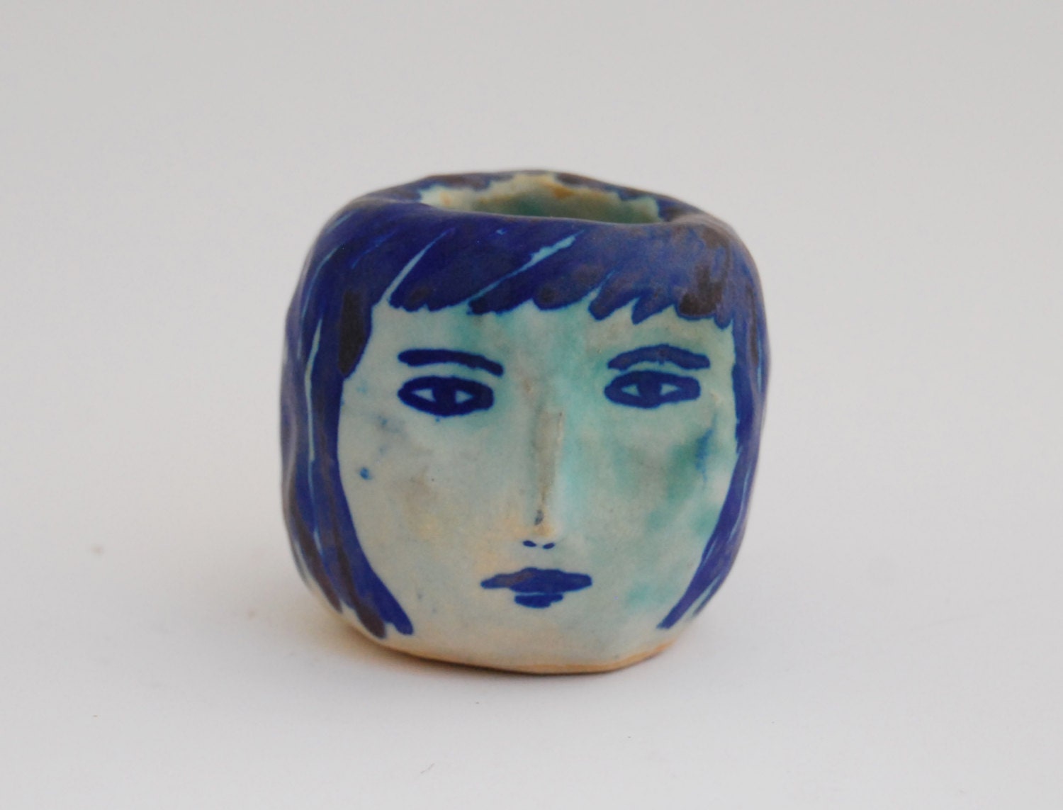 Girl's head ceramic candle holder in blue