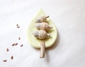 Hand sculpted acorns with a unique leaf bowl