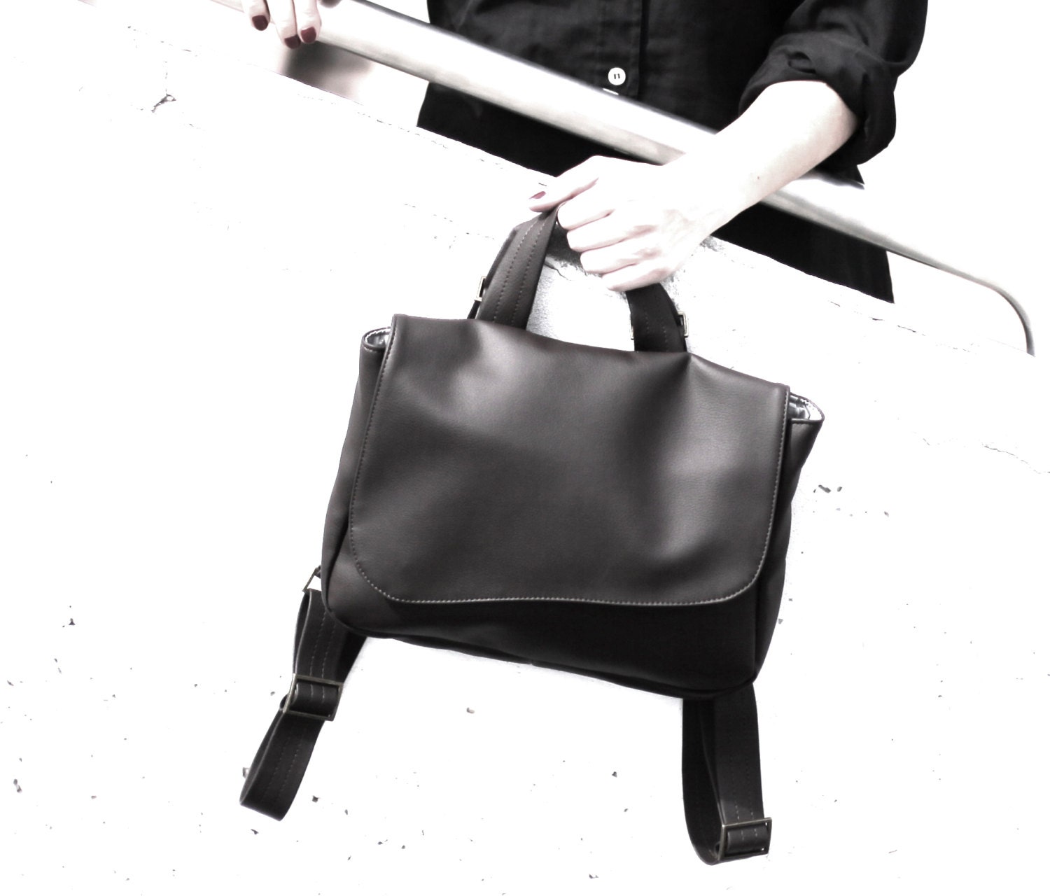 Free shipping, Convertible BLACK faux leather Backpack, shoulder bag and a messenger bag.