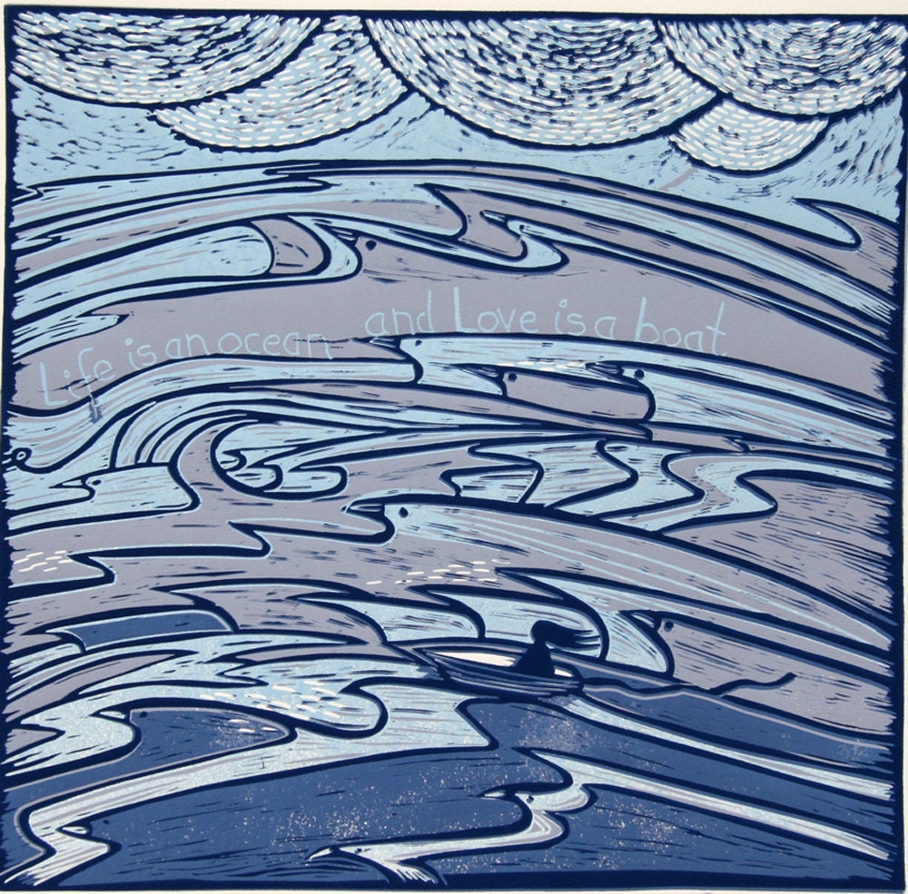 linocut, Life is an Ocean, Love is a Boat, in blue colors on cream paper