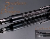 Stealth   30 cal bullet pen with carbon fiber braid. Bolt action ink advance. Very cool.