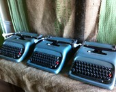 Three Aqua Underwood Olivetti Vintage Typewriters
