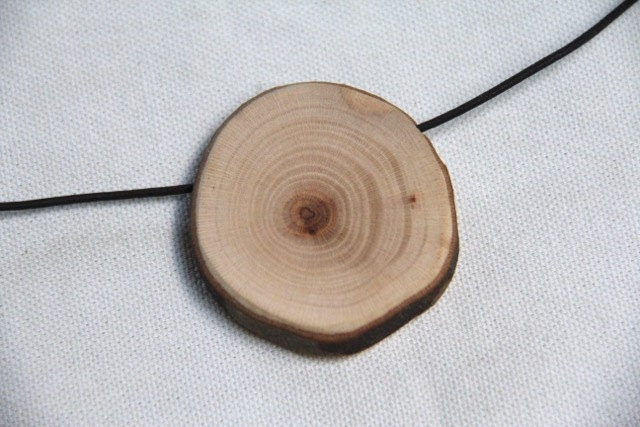 sycamore wood pendant on a leather cord