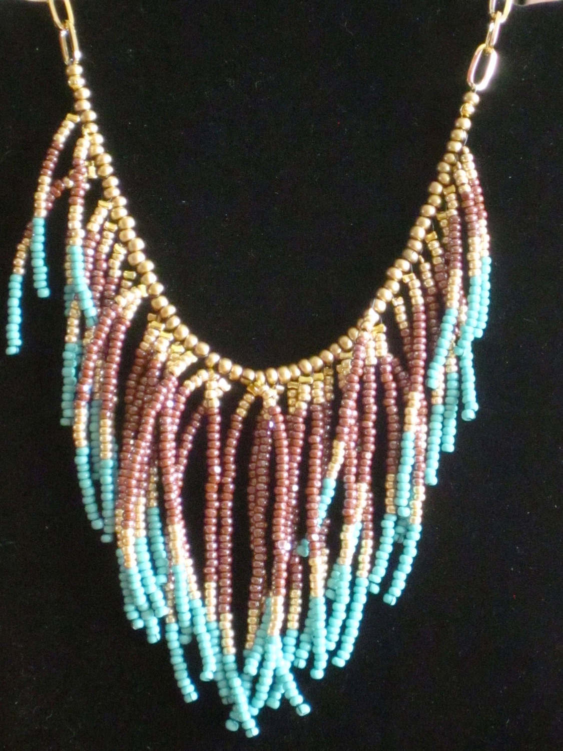 Native American style tribal fringed collar necklace in turquoise, gold and mauve