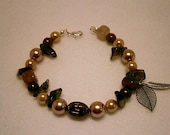 Handmade Brown Orange Bronze Goddess Spiritual Glass Beaded Bracelet with Etheric Mother Earth Leaf, Smokey Topaz gemstone chips and feather