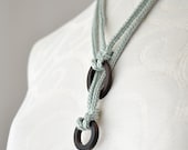 Knitted fiber jewelry necklace with ebony wood rings, light blue fiber necklace, ice blue knitted jewelry