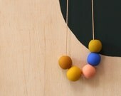 not quite round handmade beads make a necklace