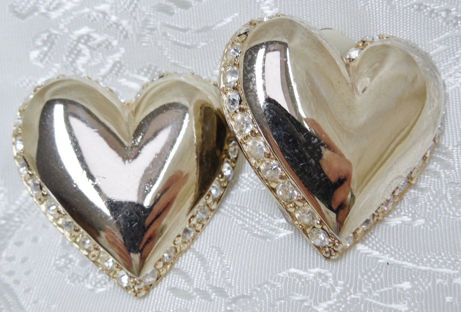 Vintage Clip On Earrings Silvertone Puffy Hearts Outlined with Rhinestones