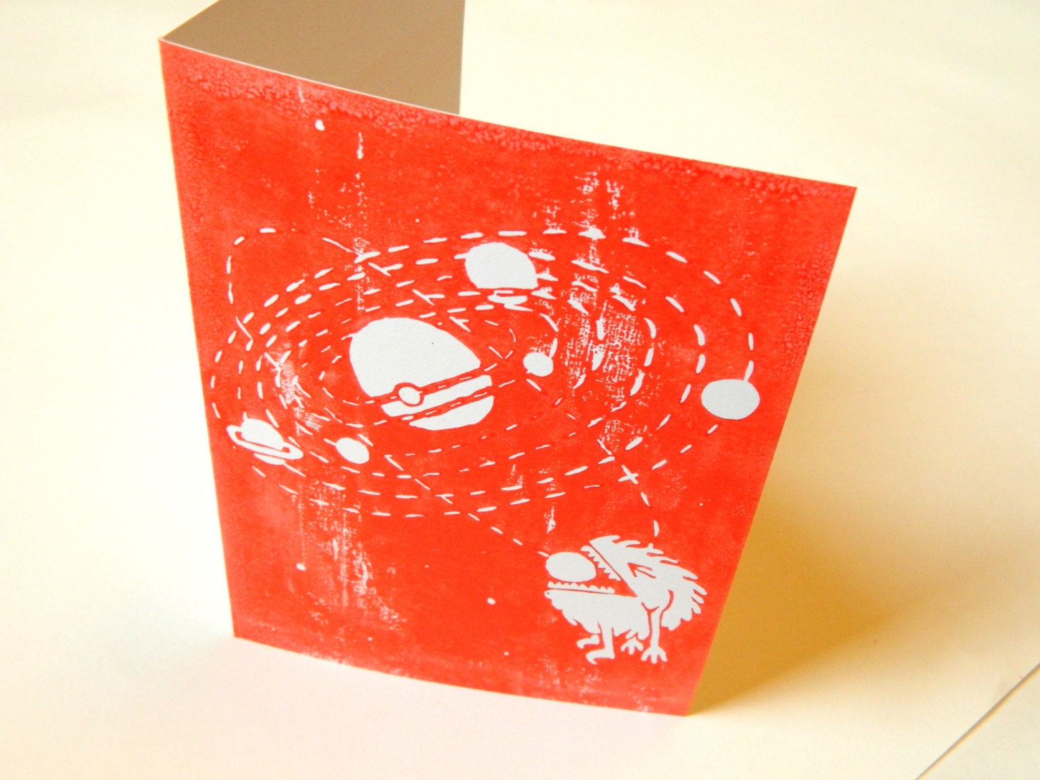 Space Greetings Card.  Lino print card - solar system with space monster.  Red