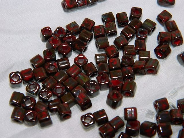 Toho Red Pepper Picasso Hybrid Cube Beads