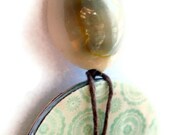 washer pendant, cream and blue circle designs, shell bead, upcycled, OOAK