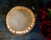 speckled tan and copper catchall plate