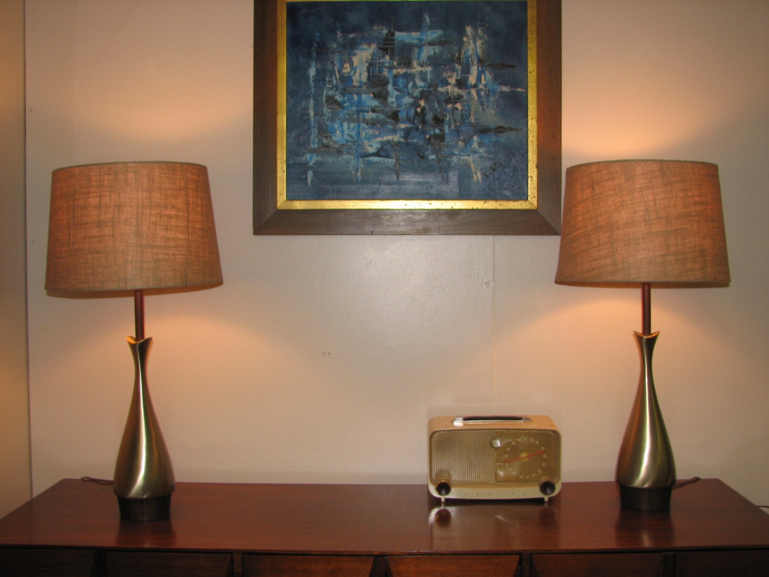Mid Century Modern 1960s metal cast bodies and walnut veneer accents with shades