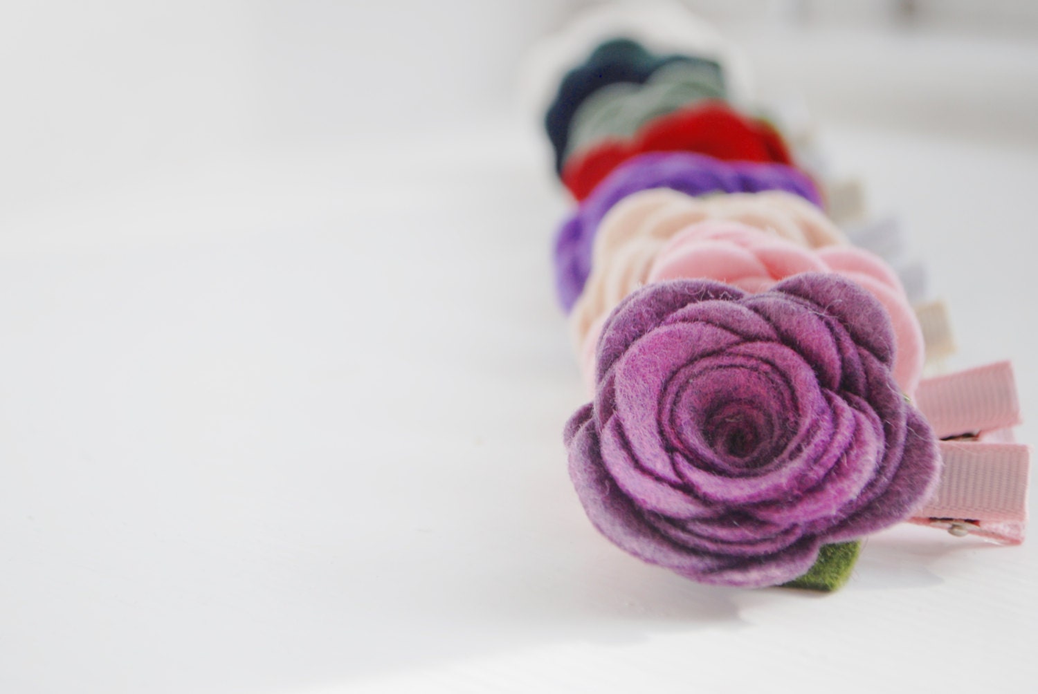 Wool Felt Rose Hair Clip, Shown in Light Purple, Light Pink, Oatmeal, and Red, Also available as  headband 