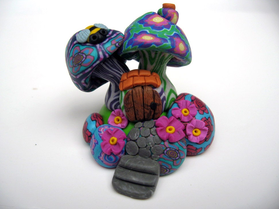 Miniature fairy mushroom house, bright millefiori patterns, tiny door and little bee