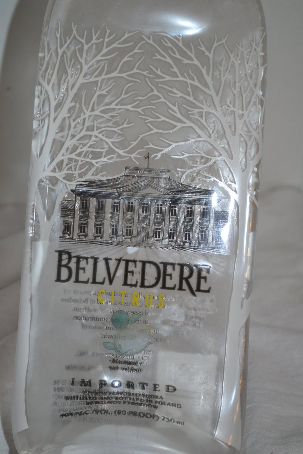 Clear Belvedere Citrus Lemon Liquor Liqueur Bottle hanging cheese tray wine