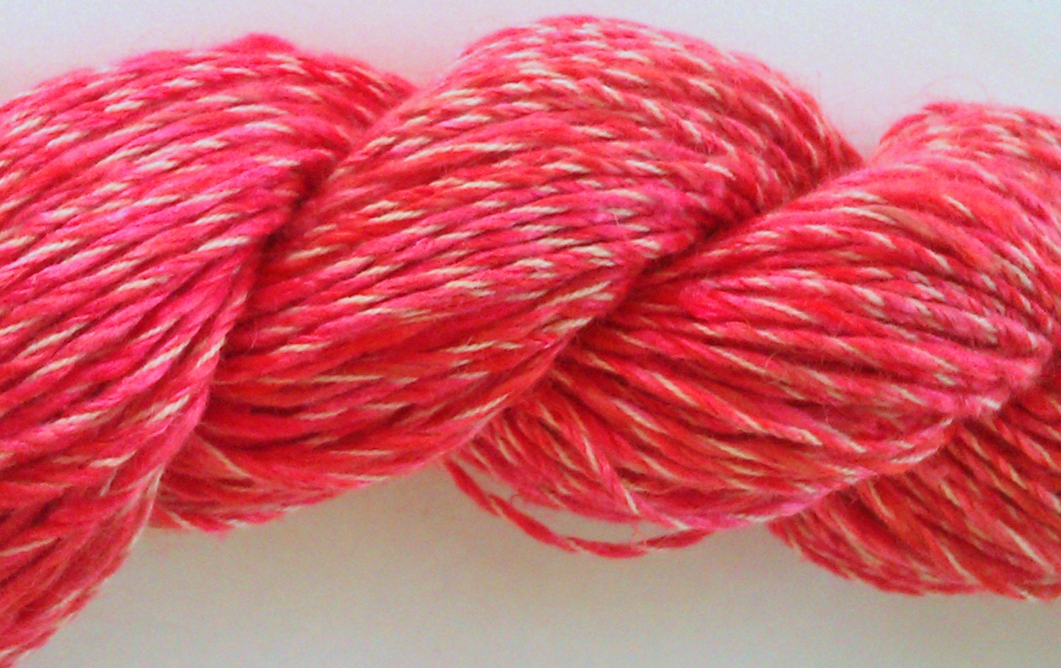 Slinky pink suri alpaca and silk . Hand spun yarn . 2 ply.  Hand processed.