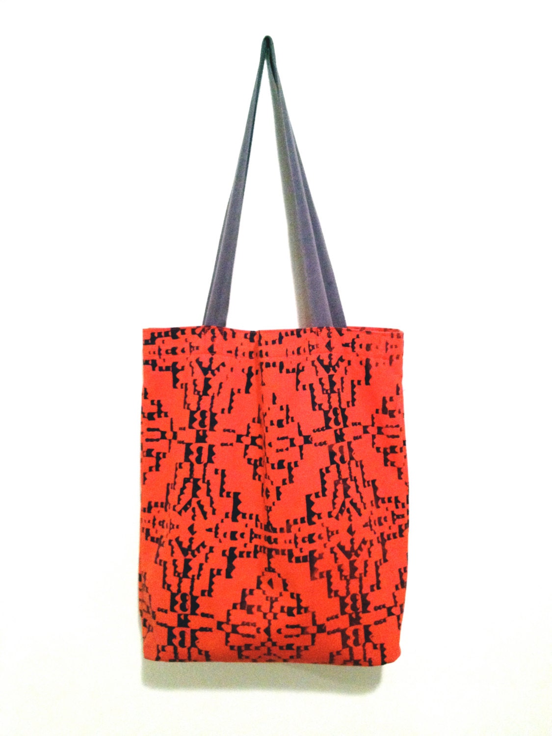 Bright red canvas tote with navy screen print
