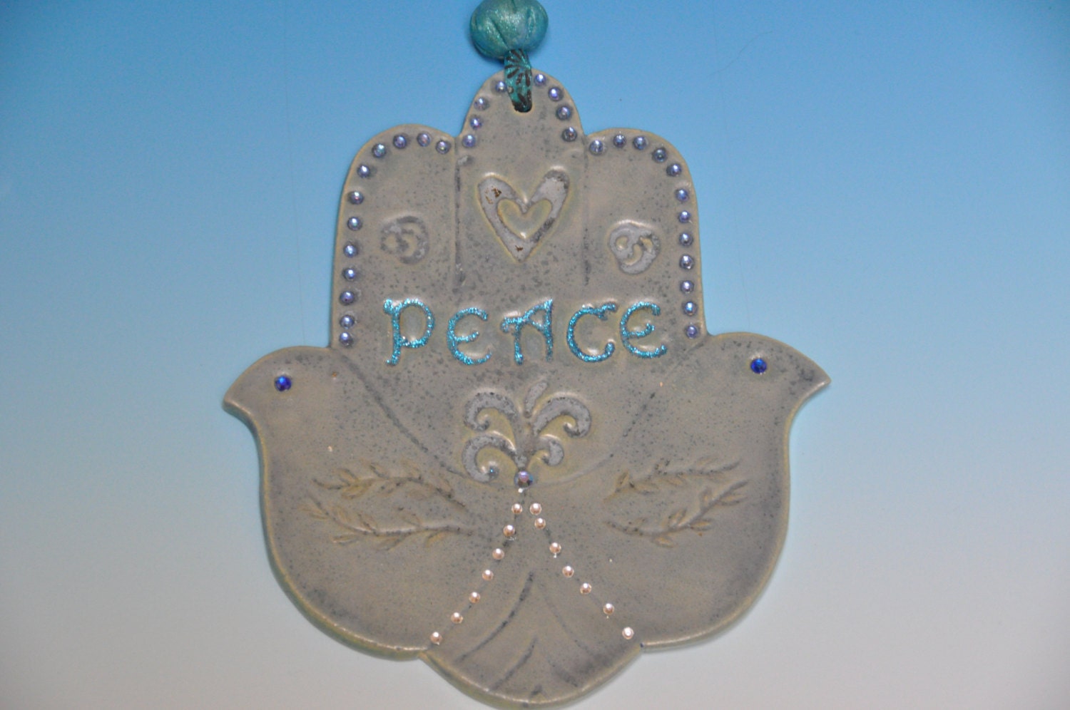 Ceramic handmade blue Hamsa hand, home décor amulet, with "PEACE" sign and Rhinestones