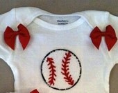 Baseball and shoulder bows onesie
