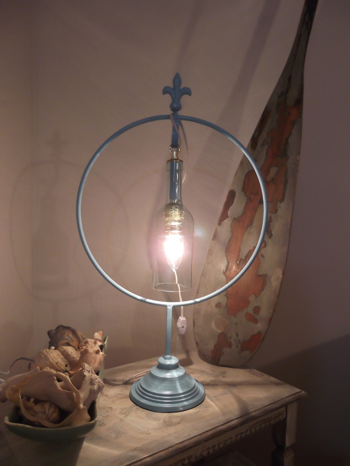 upcycled wine bottle table/bar lamp.  iron lamp holder with recycled bottle. family coat of arms wine bottle, OOAK light