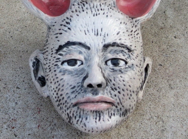 Rabbit girl ceramic wall piece.