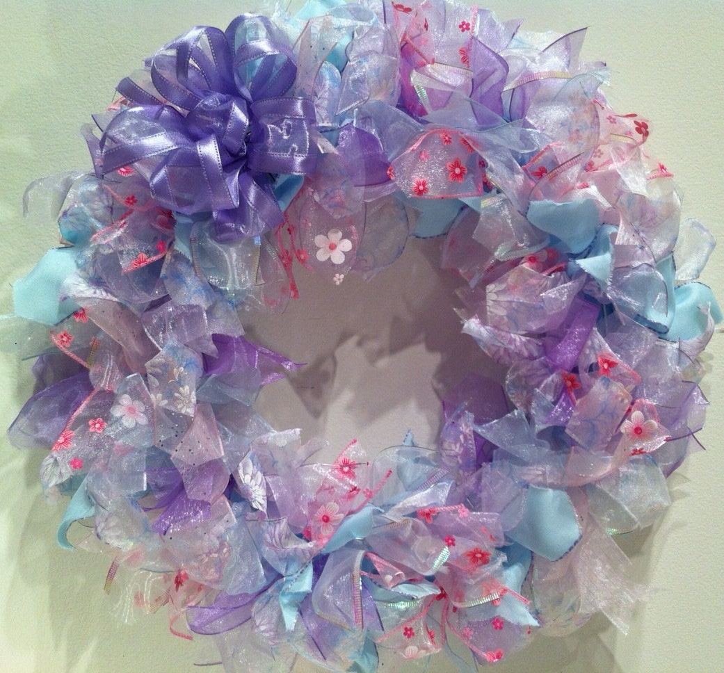 15 inch wreath made with pastel colored wire edged ribbon.