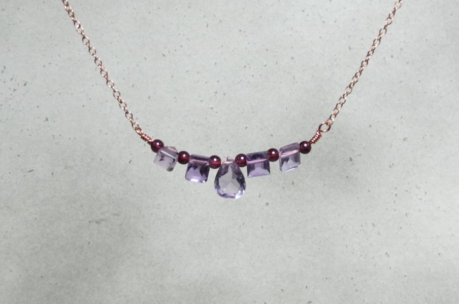 Blocking Amethyst necklace. Unusual cut purple amethyst gemstones with red garnet. NECK-089
