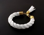 Chunky white rope bracelt with tassel charm