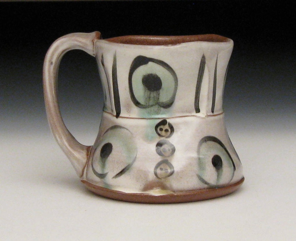 White with buttons and green / black circles /stripes terra cotta mug