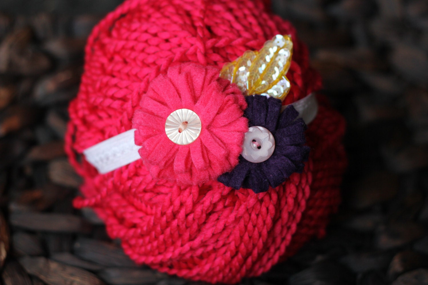 A fun and beautiful pink and purple felt flower heaband featuring a yellow sequence leaf