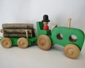 Toy tractor with wooden trailer