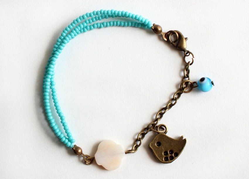Charm bracelet Turquoise czech seed beads three strand bracelet mother of pearl and antique bronze bird evil eye summer best friend gift