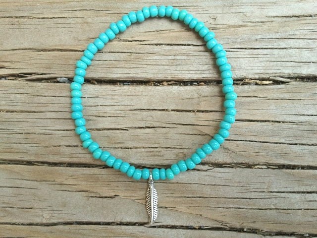 Tiny silver feather charm bracelet