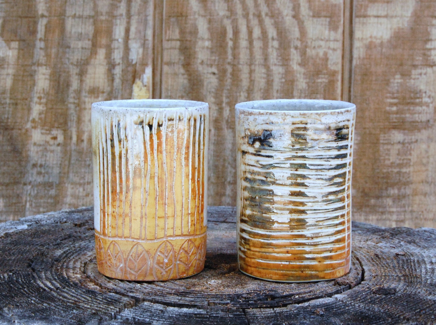 set of yellow carved wood fired tumblers
