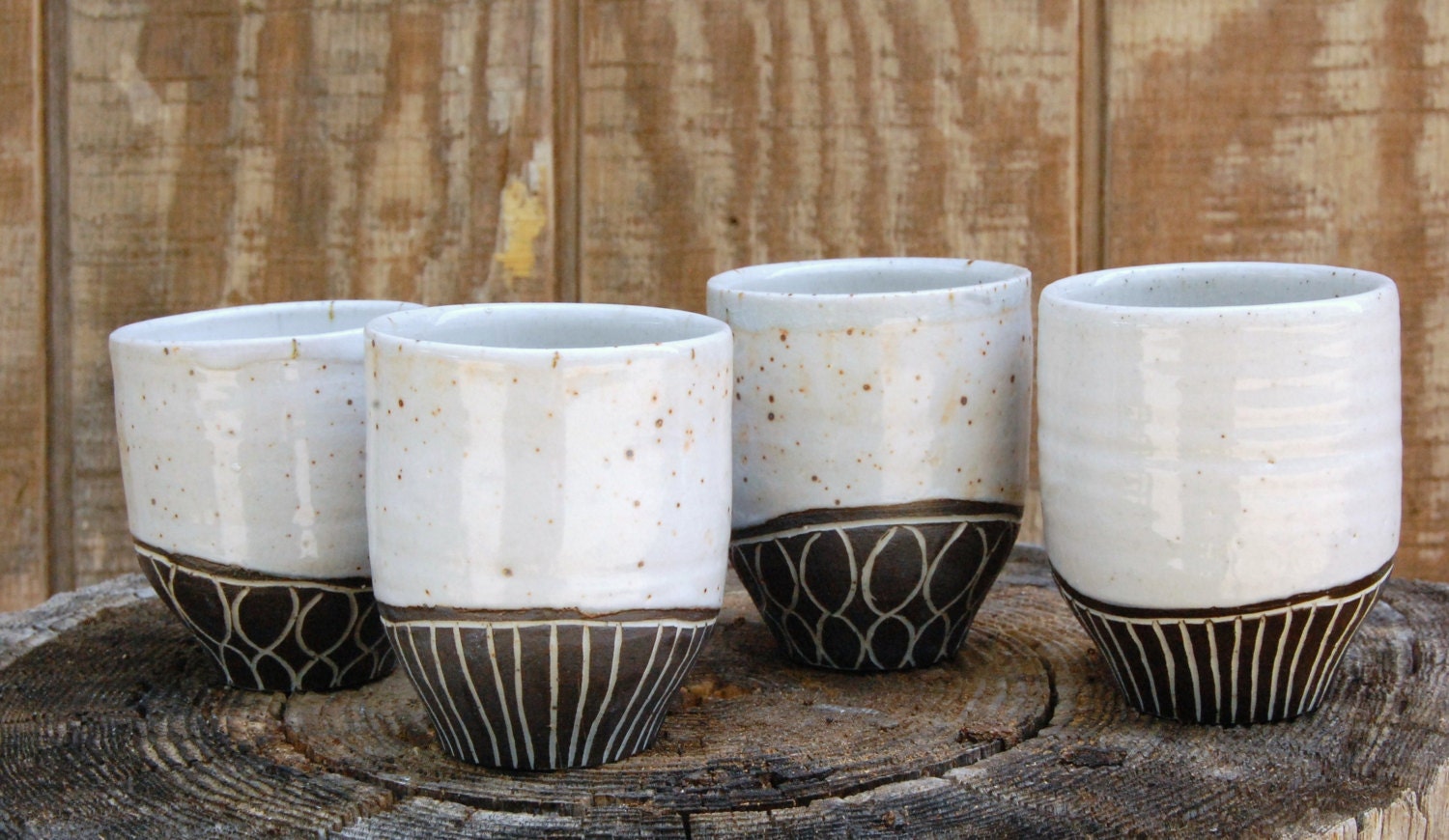 set of four slip-carved black and white tumblers