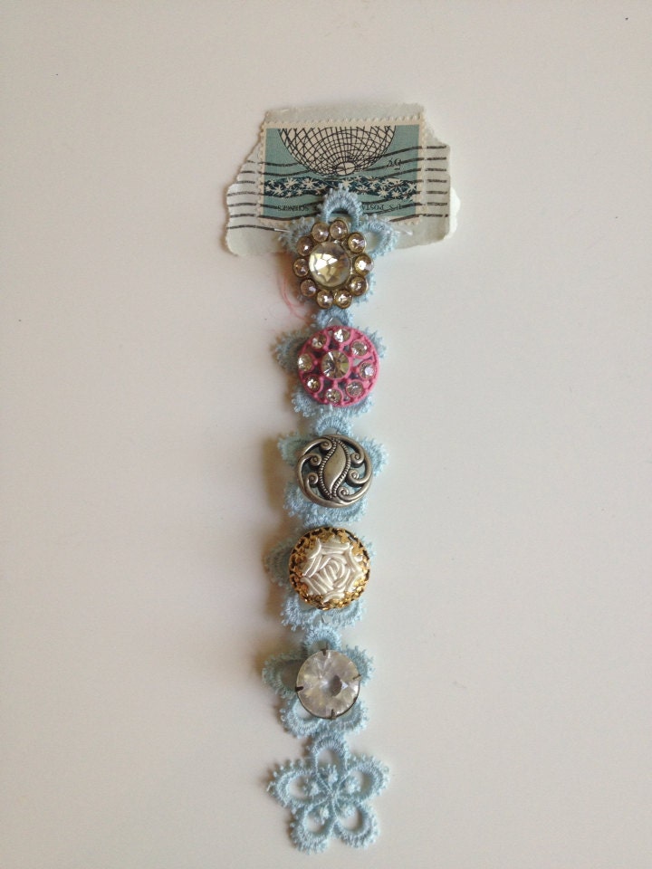 Ribbon of Vintage Buttons With Old Stamp